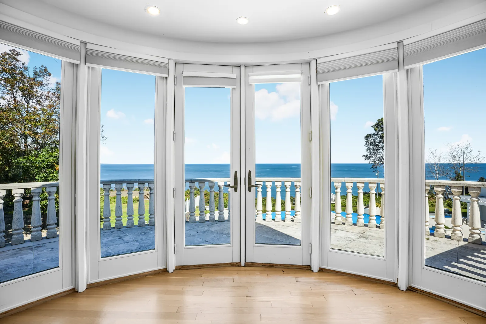 Round room with French doors to a balcony over the water